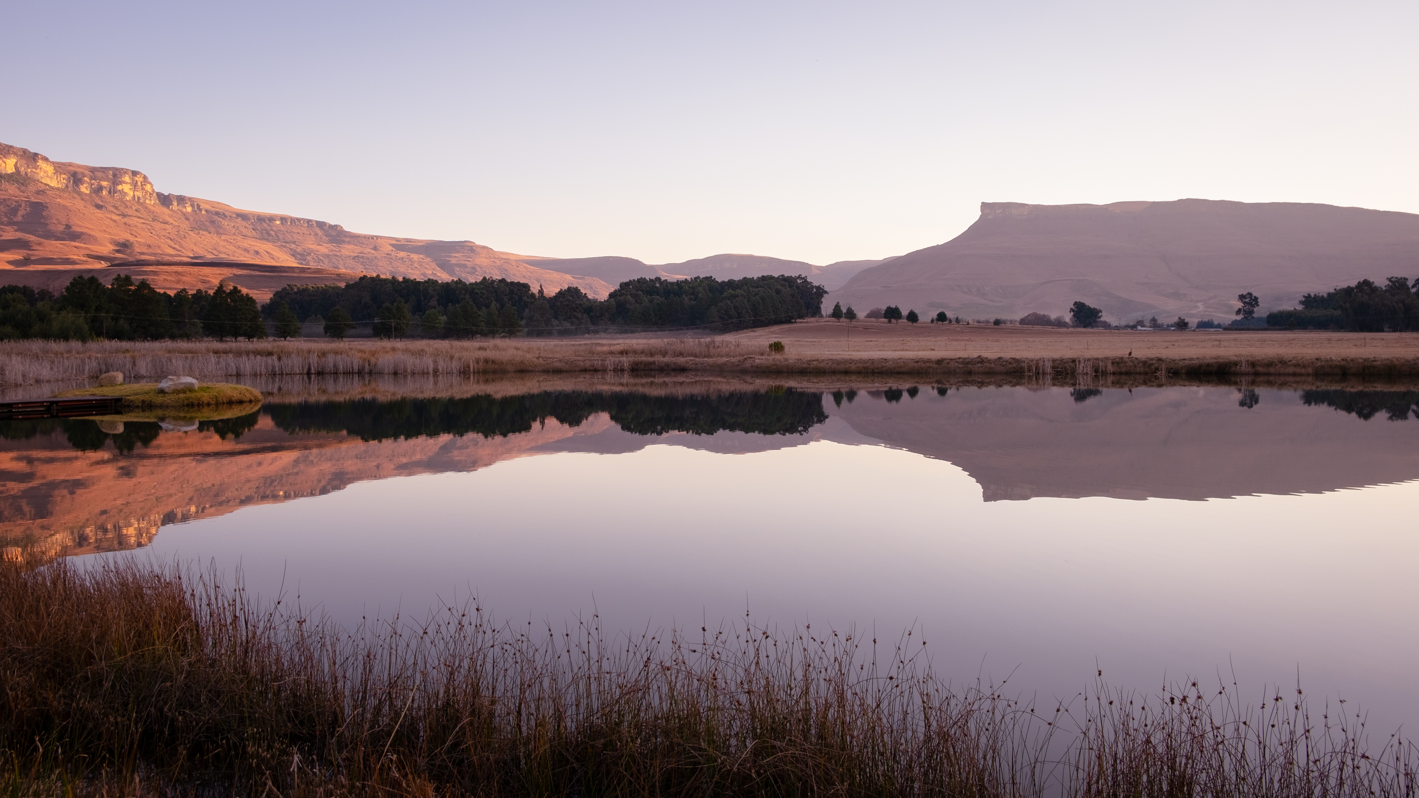 A beautiful African pastel sunset and reflections in the Kamberg